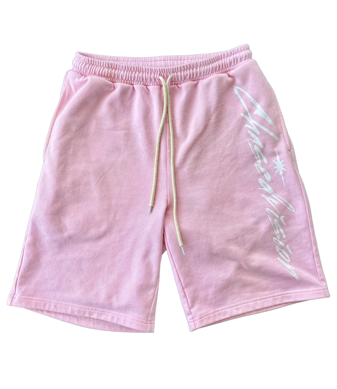 Pink shorts with a drawstring, ideal for summer outfits, paired beautifully with long sleeve tops or grey accessories.