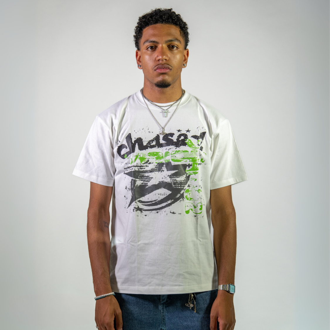 Man wearing a Chasedvision oversized cotton tee with green design, showcasing perfect fit and high-quality streetwear style.