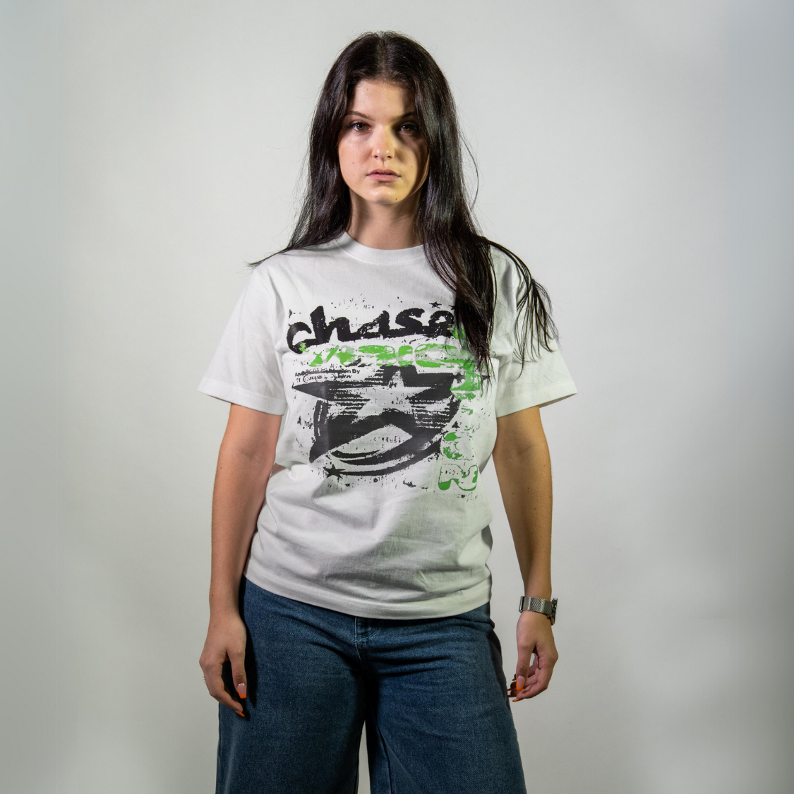 Woman wearing a Chasedvision oversized cotton tee with green design, showcasing perfect fit and high-quality streetwear style.